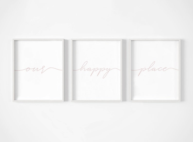 May include: Three white framed prints with the words "our happy place" written in pink cursive script.