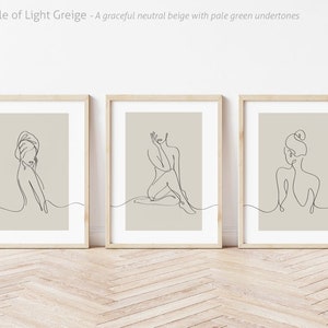 May include: Three framed line drawings of women in various poses on a beige background. The frames are light wood.