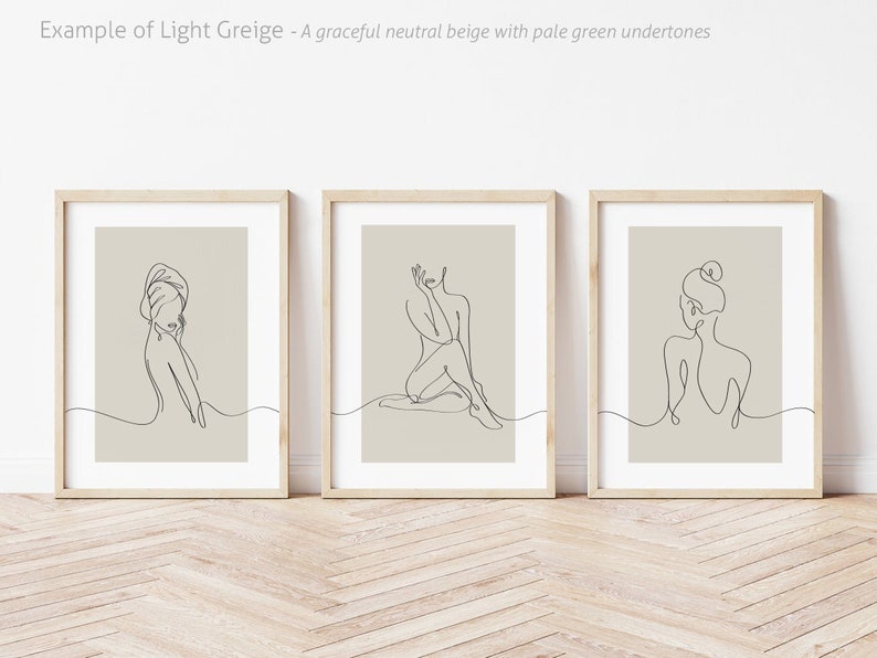 May include: Three framed line drawings of women in various poses on a beige background. The frames are light wood.