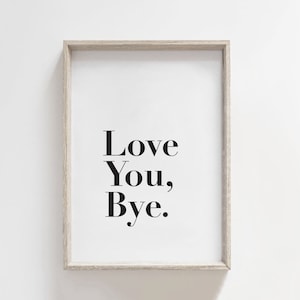 May include: A framed print with the text "Love You, Bye." in black font on a white background.