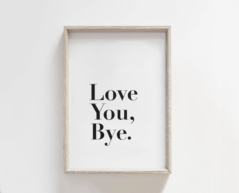 May include: A framed print with the text "Love You, Bye." in black font on a white background.