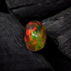 3.35Cts Black Ethiopian Opal Cabochon Oval Shape Flast Back Transparent Black Opal Cabochon For Jewelry Making Mix Fire Black Opal Gemstone