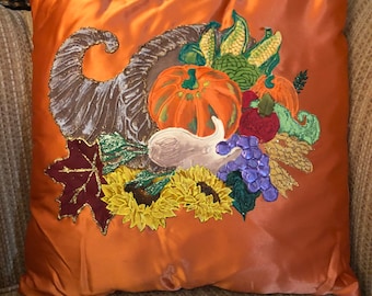 Cornucopia pillow. Orange with vegetables.