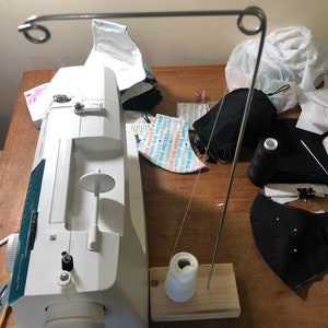 Thread guide for sewing machines