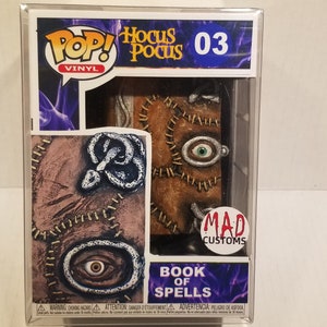 The book spells hocus  pocus funko
