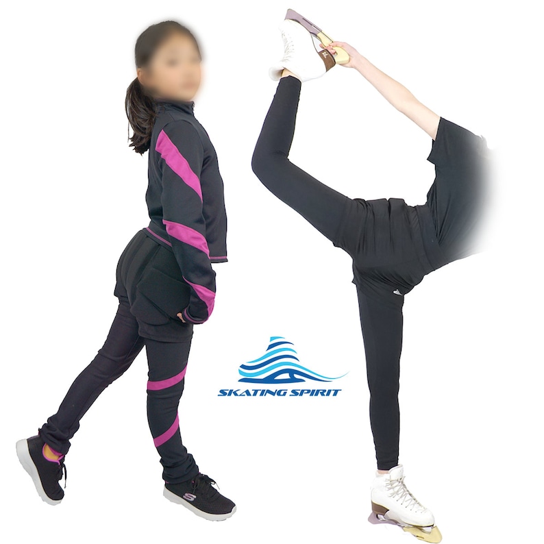 May include: Two people wearing black figure skating pants and tops. One person is wearing a pink and black striped top and the other is wearing a black t-shirt. Both are wearing black figure skating pants with pink stripes. The text "SKATING SPIRIT" is visible in the image.