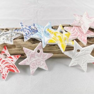 Stars handmade from modeling clay Christmas tree decorations
