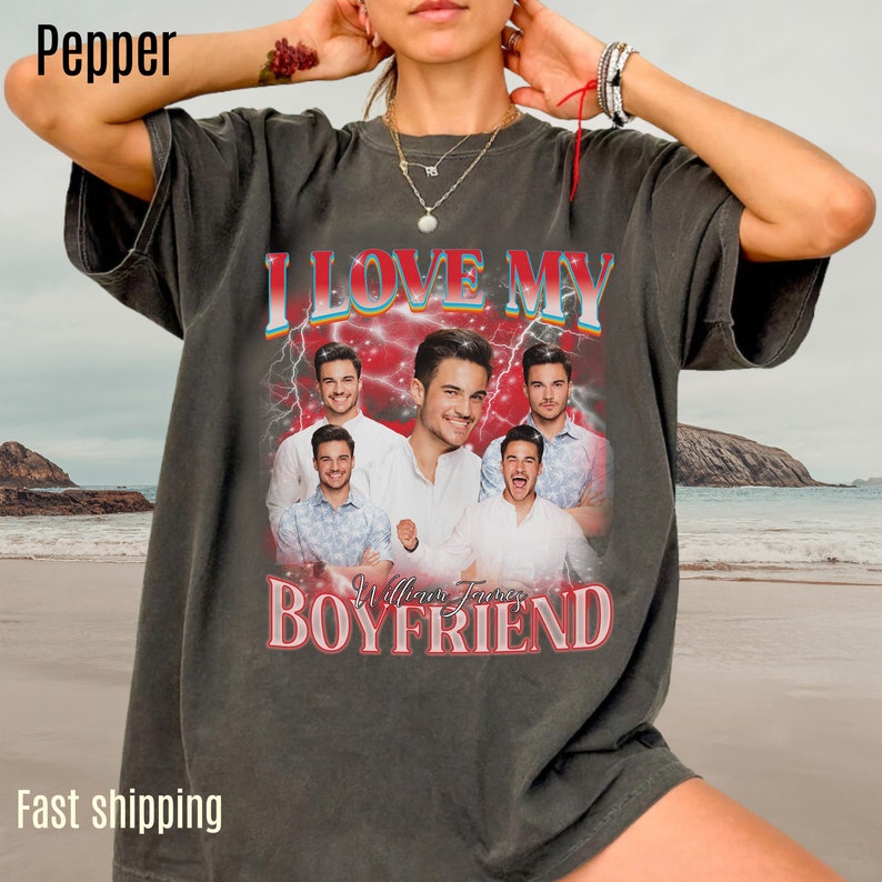 May include: A gray t-shirt with a vintage-style graphic featuring a collage of photos of a man with the text "I Love My William Jones Boyfriend" in red and blue.
