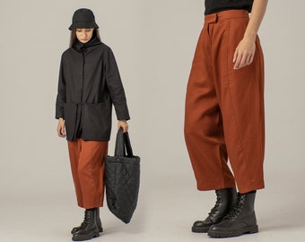 Minimalistische broek verbrand oranje, oversized gauchobroek, elegante losse broek voor dames, roestkleurige broek met platte voorkant, wijde zomerculottes