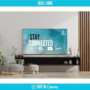 May include: A modern living room with a large flat-screen TV displaying the text "STAY CONNECTED" with social media icons. The room features a gray armchair, a small stool, and decorative items on a black shelf. A floor lamp and potted plants add to the decor.
