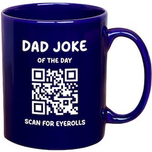 May include: A deep blue ceramic mug with a curved handle. The mug features the text "DAD JOKE OF THE DAY" above a QR code, and "SCAN FOR EYEROLLS" below. The text and QR code are white.