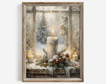 May include: A framed wall art print depicting a winter scene through a window with a large central candle, smaller candles, pine branches, pinecones, and red and gold ornaments resting on a snowy ledge, with a snowy forest visible outside.