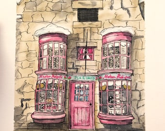 May include: A watercolor painting of a pink storefront with two large windows and a pink door. The windows are decorated with cakes and pastries. The sign above the door reads "Tea & Cakes". The sign above the left window reads "Madam Malkin's Robes for All Occasions" and the sign above the right window reads "Madam Malkin's Robes for All Occasions".