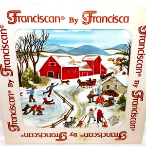 May include: A square ceramic tile featuring a winter scene with red barns, people ice skating, a horse-drawn sleigh, and a campfire. The border is cream-colored with the repeated red text "Franciscan By Francisca" surrounding the central illustration.