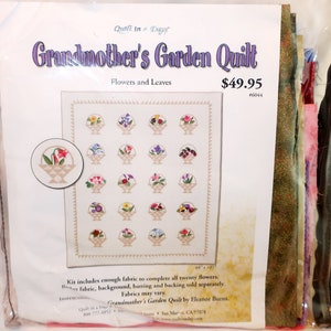 May include: A Quilt in a Day Grandmother's Garden Quilt kit featuring a pattern of twenty flower baskets. The package includes fabric for the flowers, with a finished quilt size of 88 inches by 105 inches. The cover displays the quilt design.