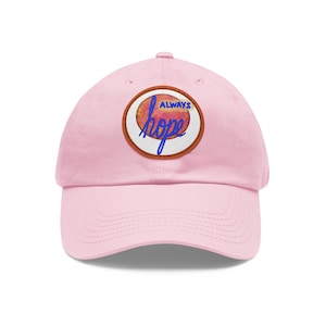 May include: Pink baseball cap with a round patch that says "ALWAYS hope" in blue lettering on a peach-colored background.