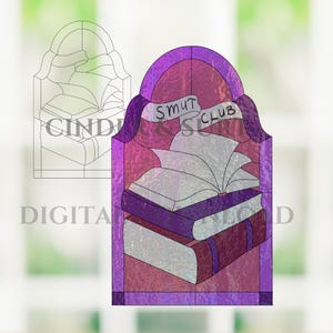 May include: Stained glass design featuring a stack of books with an open book on top. The design is in shades of purple and pink, with the words "SMUT CLUB" on a banner. A line drawing of the design is also present.