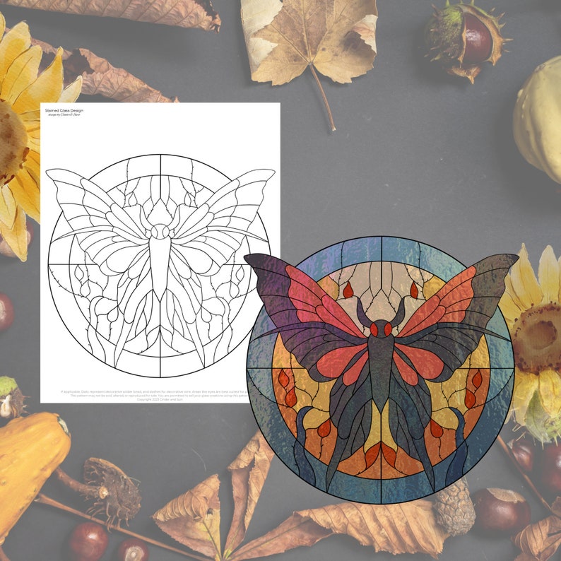 May include: A stained glass design of a butterfly with red, orange, yellow, blue, and black accents. The butterfly is in a circular frame with a grid pattern.