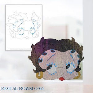 Op de afbeelding: Een printbare kleurplaat en een voltooide versie van een cartoon-personagemasker. Het masker is een zwart-witte illustratie van een vrouw met grote ogen en een rode mond. De voltooide versie van het masker is gekleurd met paars, zwart en goud.