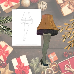 May include: A printable coloring page featuring a stained glass design of a Christmas-themed leg lamp. The lamp is shaped like a traditional Christmas stocking with a red and white striped pattern. The lamp is standing on a pair of high heels. The design is outlined in black and ready to be colored in.