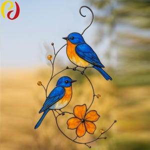 May include: Two bluebirds with orange breasts are perched on a metal branch with a flower. The birds are made of stained glass and have a wire hanger.