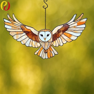 May include: A stained glass barn owl with brown, orange, and white wings in flight. The owl is hanging from a chain.