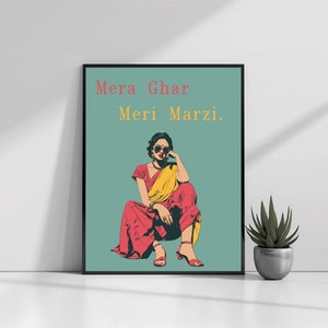 May include: A woman in a red and yellow sari sits with her legs crossed, wearing sunglasses and looking to the side. The text "Mera Ghar Meri Marzi." is written in red and yellow on a teal background.
