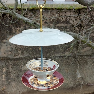 Feeding station for birds made from collection cups