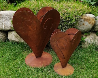 Heart-shaped planter made of corten steel, available in 2 different designs.