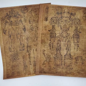 May include: Two vintage-style prints featuring detailed mechanical drawings of a robot. The prints are on aged, tan-colored paper, with intricate black line art depicting the robot's design and internal components. The prints are displayed side by side.