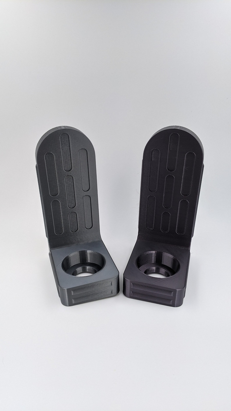 Lightsaber wall mount brackets, 3D printed in high detail PLA Plastic, Star Wars themed to hold and protect your saber while hanging on your wall for display . Available in majority colors and will fit majority of lightsabers on the market today .