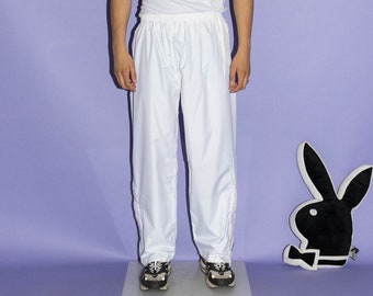 Joggers deportivos impermeables llamativos de los años 90 en blanco puro