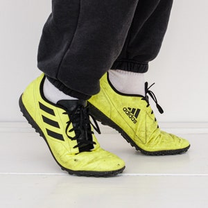 90s Vintage dirty football trainers in neon yellow/black
