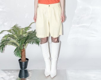 Vintage Y2K adjustable waist cargo shorts in pastel yellow
