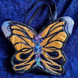 Bolso en forma de mariposa con amatista
