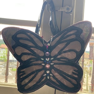 Bolso en forma de mariposa rosa