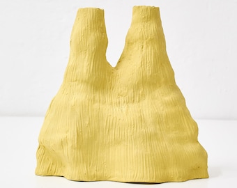 Hand-built yellow vase with rough texture