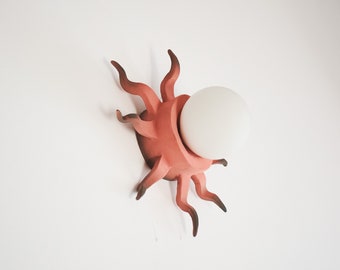 Hand-built ceramic red lamp to hang on wall