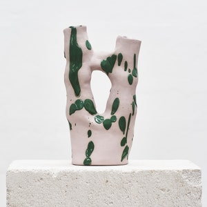 Pink vase with green splash