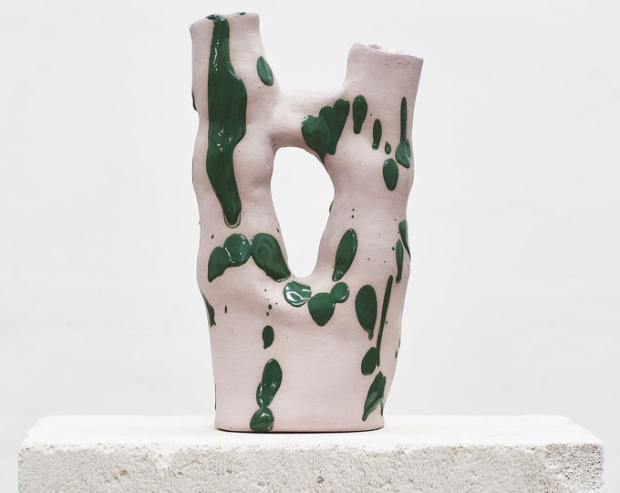Pink vase with green splash