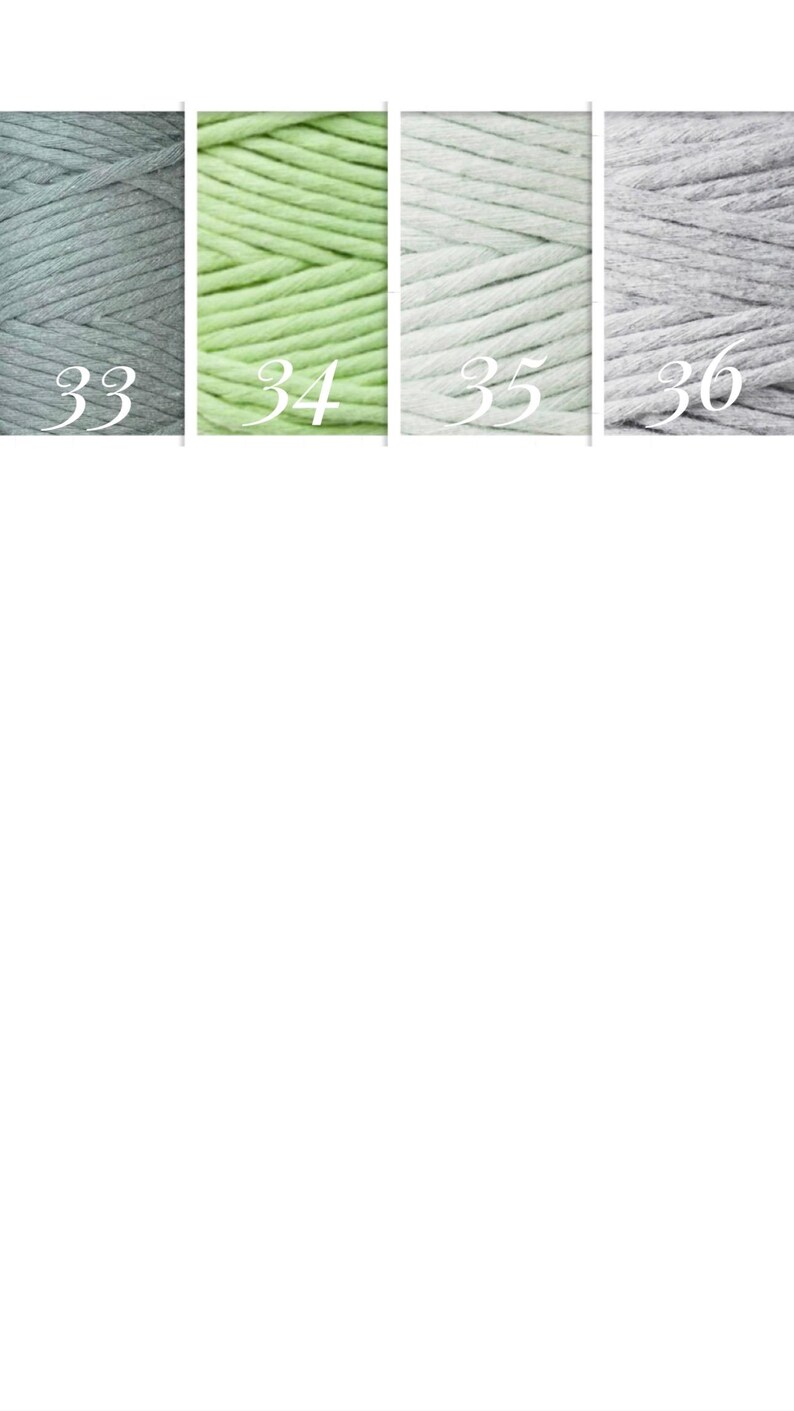 May include: Four skeins of yarn in different colors: light gray, light green, white, and gray. The skeins are labeled with numbers 33, 34, 35, and 36.