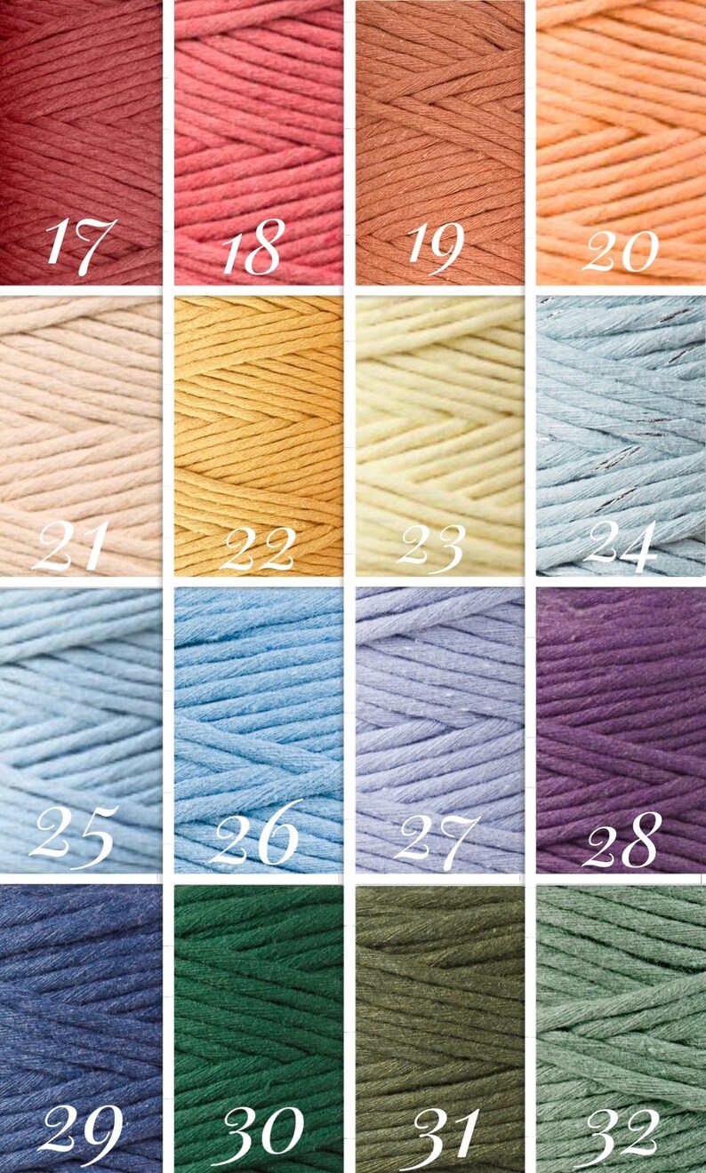 May include: A collection of 16 spools of cotton cord in various colors, including red, pink, orange, yellow, blue, purple, green, and brown. The spools are numbered 17 through 32.