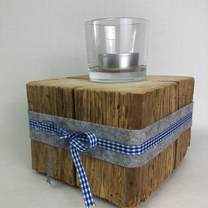 Rustic candle holder made from reclaimed wood beams
