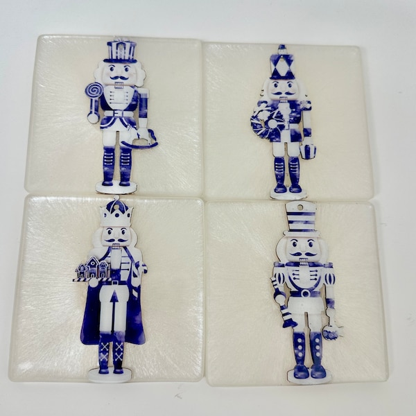 Christmas nutcracker resin coasters. Traditional holiday decor. Pearl White resin topped with grand millennial blue and white 3d nutcrackers