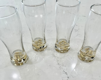 4 beer glasses w real brass shell bullet casings cast in resin. Great gift for hunters, beer lovers. Unique gift for dad, husband