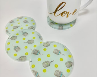 Pickle ball watercolor resin coaster set. Super fun pickle ball lover gift. Blue and green watercolor paddle art in clear resin. Great gift