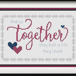 May include: Cross stitch pattern with a white background and a pink and blue heart design. The text reads "And so together they built a life they loved."