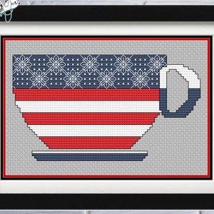 May include: A cross-stitch pattern of a red, white, and blue coffee cup with a saucer. The cup is decorated with a pattern of stars and stripes.