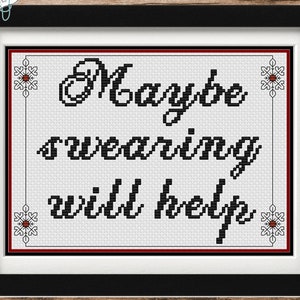 May include: Framed cross-stitch art with the text "Maybe swearing will help" in black on a white background. The frame is black with a white mat and a red border. Decorative snowflake accents are in each corner.