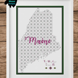 May include: A cross-stitch pattern of the state of Maine with a floral design and the text "Maine The Way Life Should Be".